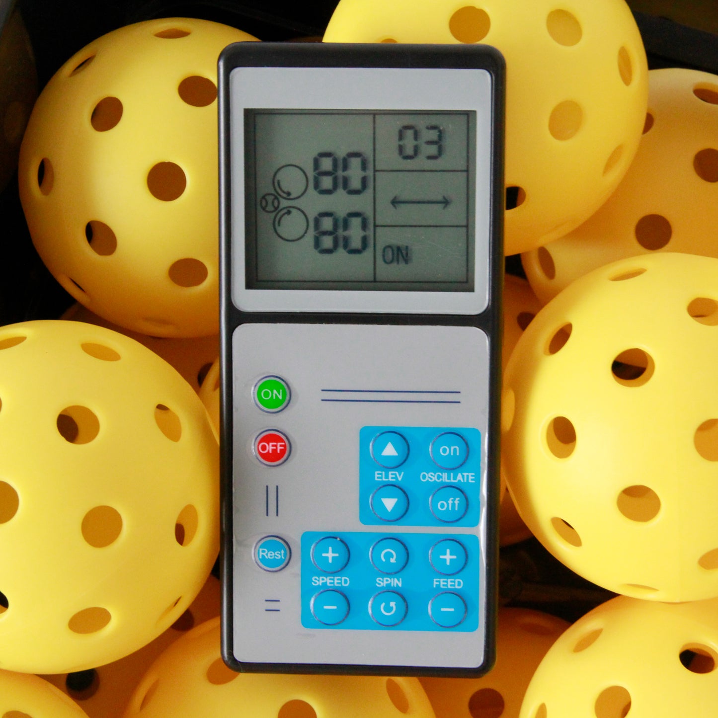 Jbotsports Pickleball Machine Remote Control - Digital Controller with Speed/Elevate/Feed Settings (Surrounded by Yellow Pickleballs)