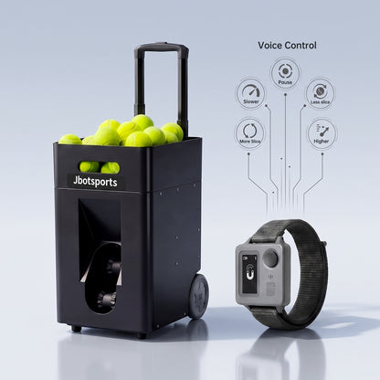 tudio feature graphic of black Jbotsports JT-02 Pro portable trolley tennis ball machine with retractable pull handle and full hopper of yellow tennis balls on light gray reflective background; grey voice control smart wristwatch displayed on lower right, connecting circuit icons showing voice command functions: Pause, Slower, Less slice, More slice, Higher for hands-free tennis training adjustment
